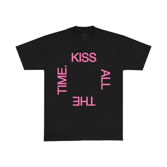 Black t shirt from Harry Styles merch featuring bold pink KISS ALL THE TIME typography graphic printed across the front