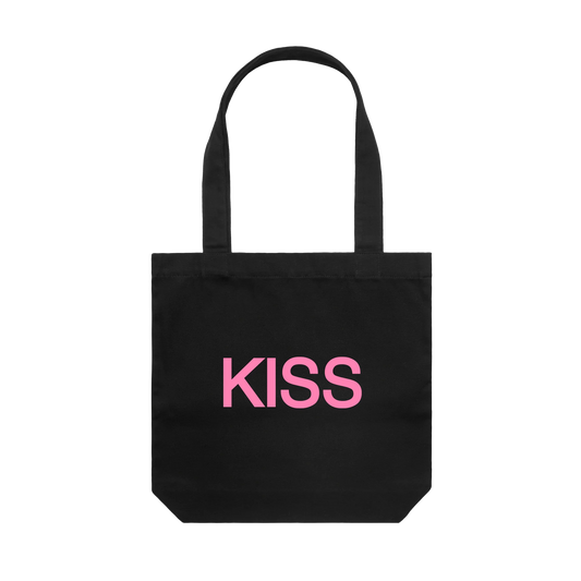 Black tote bag from Harry Styles merchandise featuring bold pink KISS graphic printed across the front panel